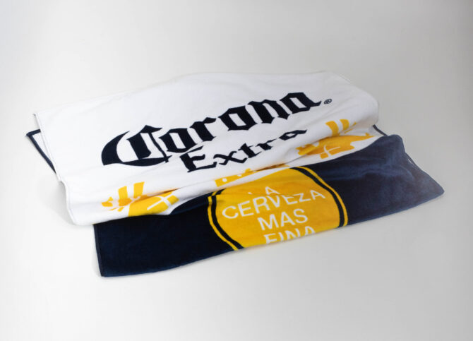 Toalha de Praia Corona [PACK 50 UNIDADES]