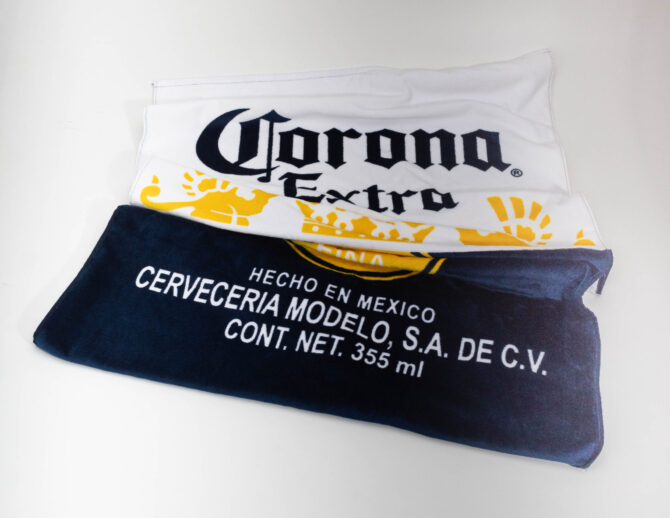 Toalha de Praia Corona [PACK 50 UNIDADES]